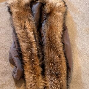 Mens tan parka with coyote trim. Size Large
